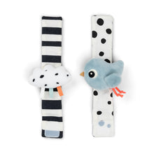 Load image into Gallery viewer, Two baby wrist rattles with striped and polka dot patterns on a white background
