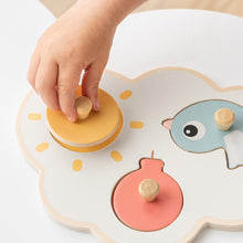 Load image into Gallery viewer, Child playing with Done by Deer Happy Clouds First Peg Puzzle
