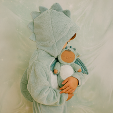 Load image into Gallery viewer, Child in a dragon-themed outfit holding a plush toy with a soft, neutral background