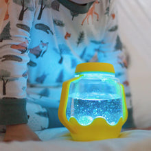Load image into Gallery viewer, Child playing with Glo Pals Sensory Jar - Yellow