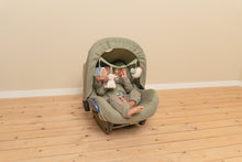 Load image into Gallery viewer, Baby in a green car seat on a wooden floor with a beige wall background and baby seat with Little Farm stroller chain