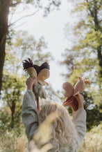 Load image into Gallery viewer, Girl holding two fairies against a blurred natural background