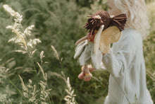 Load image into Gallery viewer, Person holding a fairy plush toy in a field of tall grass