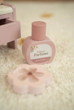 Load image into Gallery viewer, Pink perfume bottle labeled 'Flower Parfum' on a soft surface