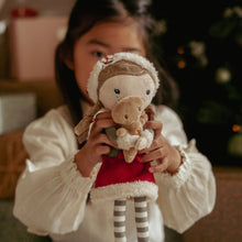 Load image into Gallery viewer, Child holding a plush toy little dutch Rosa with a Christmas gingerbread man