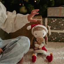 Load image into Gallery viewer, Child holding a plush toy little dutch Rosa with a Christmas gingerbread man