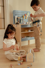 Load image into Gallery viewer, girl playing with Little dutch Wooden toy toolbox with tools with the little dutch workbench in the background