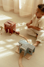 Load image into Gallery viewer, child playing with wooden police station and wooden fire station