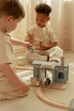 Load image into Gallery viewer, Two children playing with wooden police station