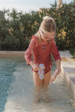Load image into Gallery viewer, Child playing with Little dutch Dreamy Mermaid Dive Figures Set of three ocean-themed weighted learn to swim aids: a mermaid, a starfish, and a seahorse