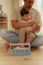 Load image into Gallery viewer, Boy playing with Little dutch Wooden toy toolbox with tools