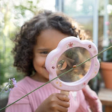 Load image into Gallery viewer, girl looking through magnifying glass at a ladybird
