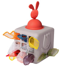 Load image into Gallery viewer, Colorful children&#39;s toy with a red top and various compartments on a white background
