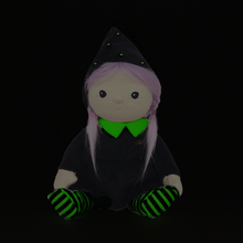 Load image into Gallery viewer, Plush toy with black outfit, green accents, and striped shoes on a black background
