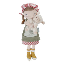 Load image into Gallery viewer, Plush cuddle doll named Rosa wearing a red and white checkered dress and a green apron, holding a white sheep. The doll has brown hair, wears yellow boots, and has a red and white checkered headscarf.
