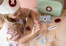 Load image into Gallery viewer, girl playing with Little Dutch Doctor&#39;s Bag Play Set
