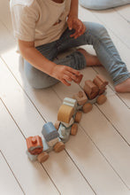 Load image into Gallery viewer, Toddler playing with Little Dutch Forest Friends Stacking Train
