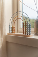 Load image into Gallery viewer, Decorative rainbow abacus on a windowsill with light curtains and a blurred background

