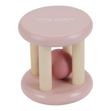 Load image into Gallery viewer, A pink and beige wooden roller rattle toy with a ball in the center and four cylindrical supports.
