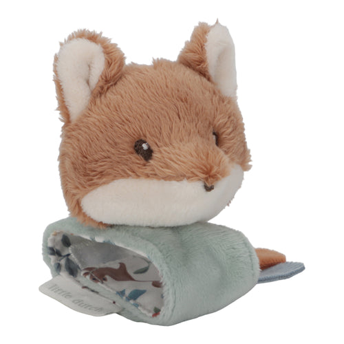 A plush wrist rattle featuring a fox design with a seagull motif on top. It includes crinkly parts and a label, designed for babies.