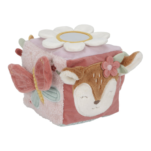 A soft activity cube for babies with a butterfly design, featuring cute crinkle wings, rattling sound, and colorful labels. The cube is primarily pink with floral patterns and a cartoon depiction of a butterfly.