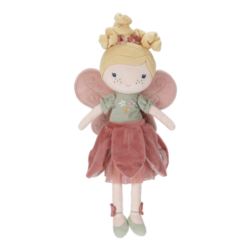 Stuffed toy fairy with pink wings and a dress on a white background