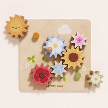 Load image into Gallery viewer, Wooden toy with colourful gears shaped like flowers and a sun on a beige background
