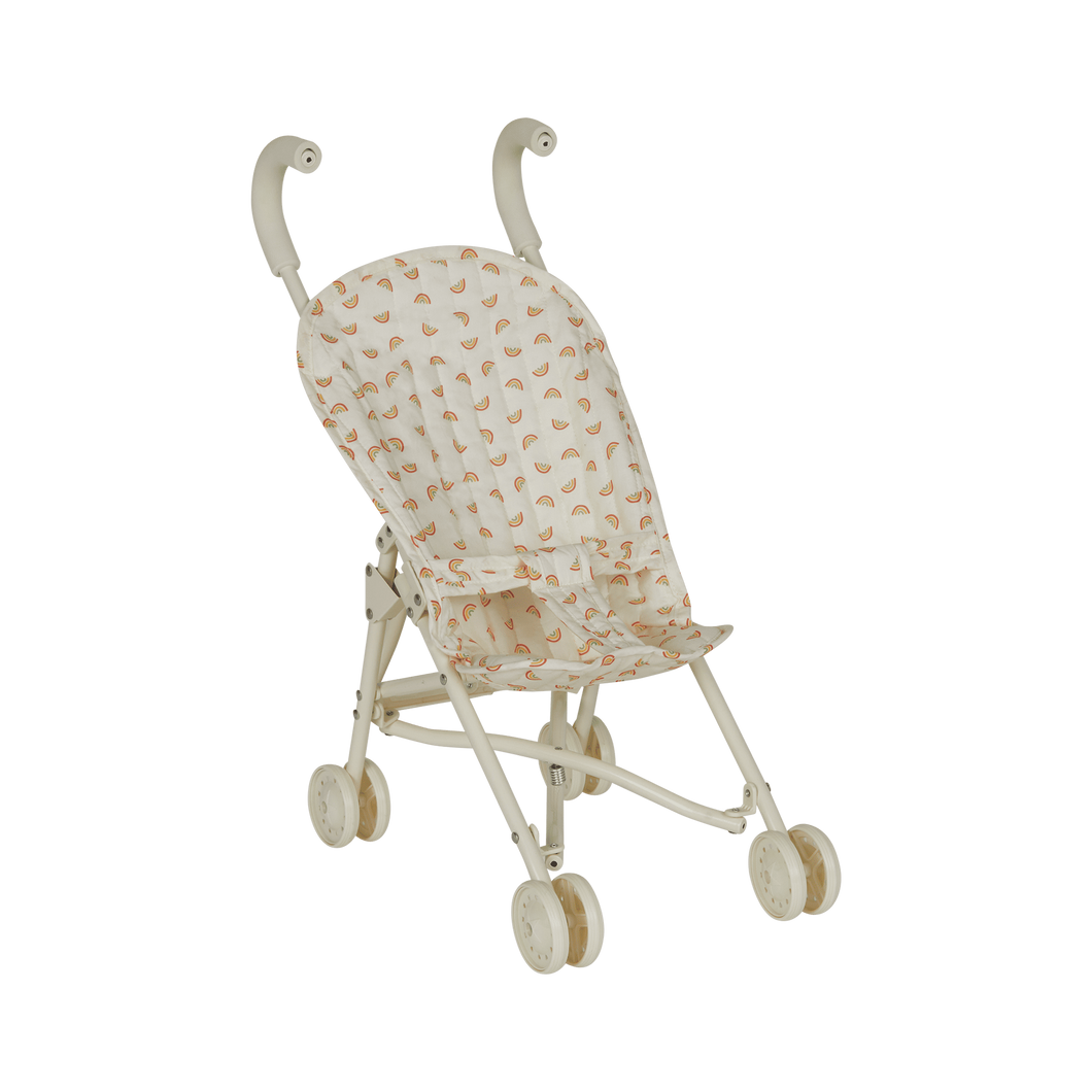 Miniature stroller with a patterned canopy on a white background