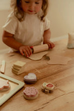 Load image into Gallery viewer, Child playing with wooden toys on a wooden table
