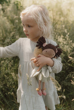 Load image into Gallery viewer, Child holding a doll in a natural setting and Little Dutch Fairy Garden Evi toy fairy 
