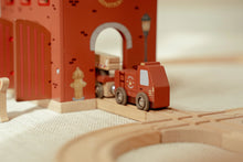 Load image into Gallery viewer, Red toy truck and fire engine on a wooden track with a red archway in the background.
