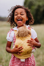Load image into Gallery viewer, Child with an Olli ella doll in an olli ella honey carrier.
