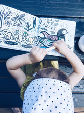 Load image into Gallery viewer, Girl playing with Wee Gallery Colour Me - Who&#39;s in the Pond? Book
