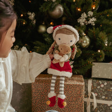 Load image into Gallery viewer, Child holding a plush toy little dutch Rosa with a Christmas gingerbread man
