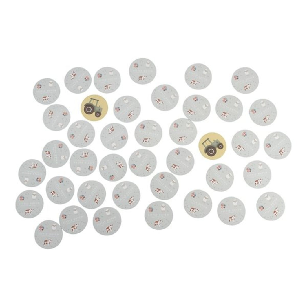 Set of round stickers with tractor designs on a white background