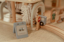 Load image into Gallery viewer, Wooden toy set with a car wash station and a small sign 
