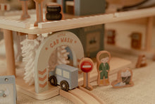 Load image into Gallery viewer, Wooden toy car wash set with a car, person, and stop sign on a track.
