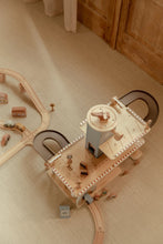 Load image into Gallery viewer, Wooden toy train set on a wooden floor
