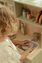 Load image into Gallery viewer, Child playing with a toy kitchen set, focusing on the sink area.
