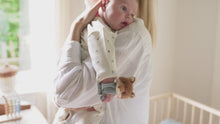 Load and play video in Gallery viewer, A plush wrist rattle featuring a fox design with a seagull motif on top. It includes crinkly parts and a label, designed for babies.
