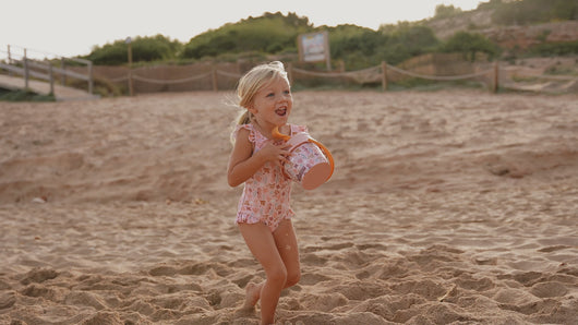 girl playing with Little Dutch Beach Set 