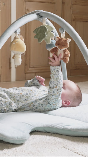 Baby playing with Forest Friends Activity Playmat Gym