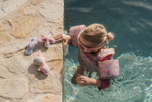 Load image into Gallery viewer, Child playing with Little dutch Dreamy Mermaid Dive Figures Set of three ocean-themed weighted learn to swim aids: a mermaid, a starfish, and a seahorse
