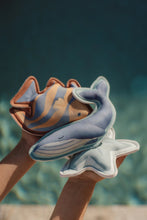 Load image into Gallery viewer, Child playing with Little dutch Ocean World Dive Figures Set of three ocean-themed weighted learn to swim aids: a whale, a starfish, and a fish
