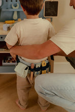 Load image into Gallery viewer, Boy playing with Little Dutch Toy tool belt with various tools
