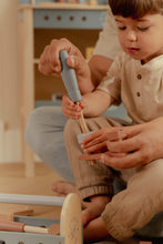 Load image into Gallery viewer, boy playing with Little dutch Wooden toy toolbox with tools 
